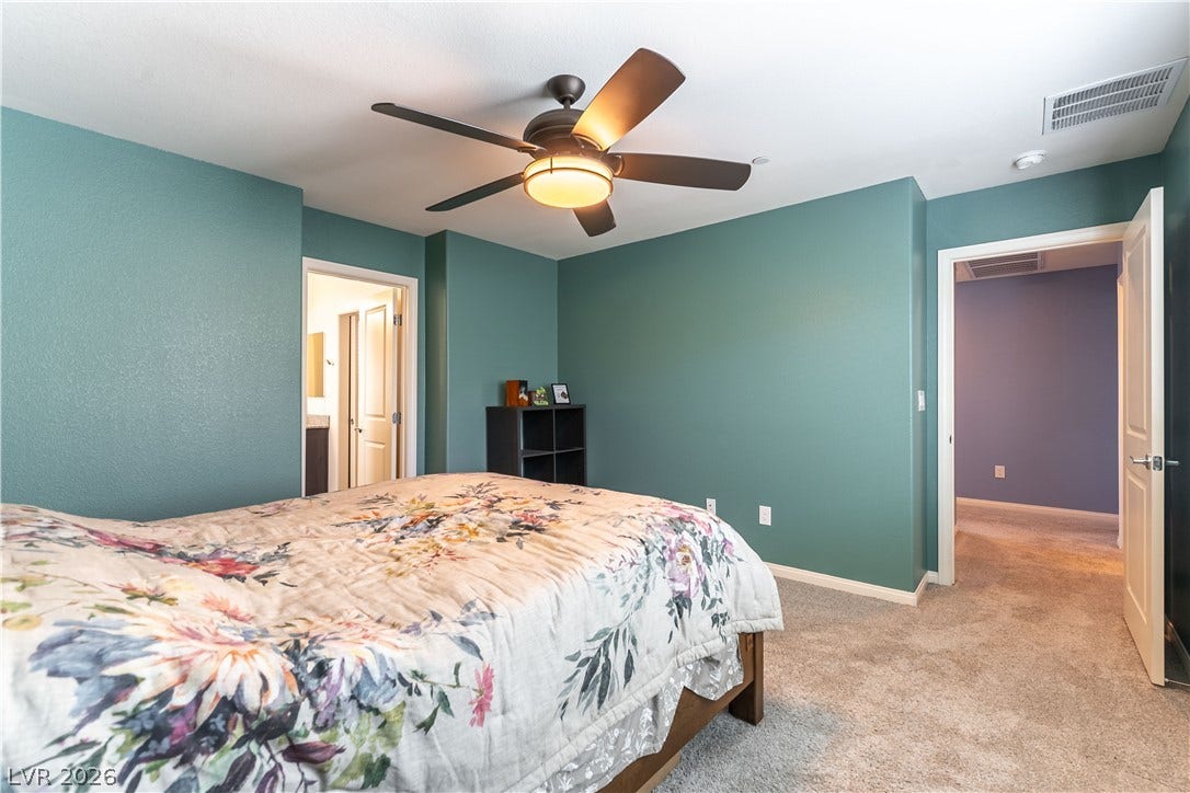 6911 Orange Horizon Street, North Las Vegas, NV 89086 Plush wall-to-wall carpeting and smooth finishes define this comfortable private retreat.