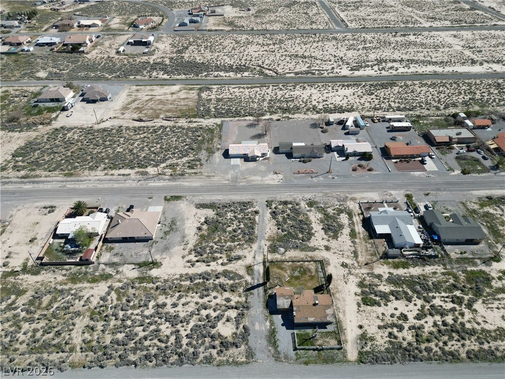 2491 Mandy Avenue, Pahrump, NV 89048 An aerial perspective reveals the expansive desert landscape surrounding the residential properties.