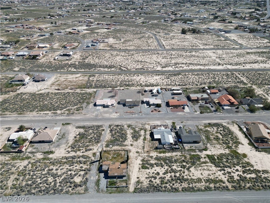 2491 Mandy Avenue, Pahrump, NV 89048 An aerial perspective showcases the desert landscape and spread of neighborhood homes.