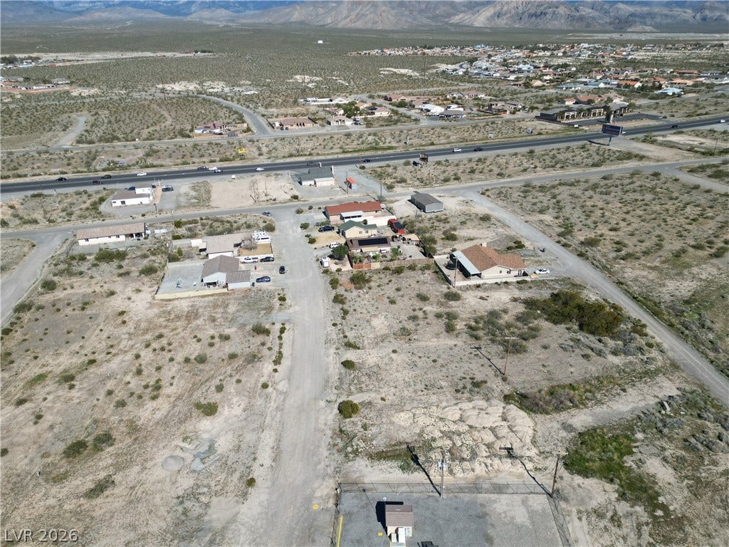 Sprawling desert vistas surround this mountain-view neighborhood property with endless potential.
