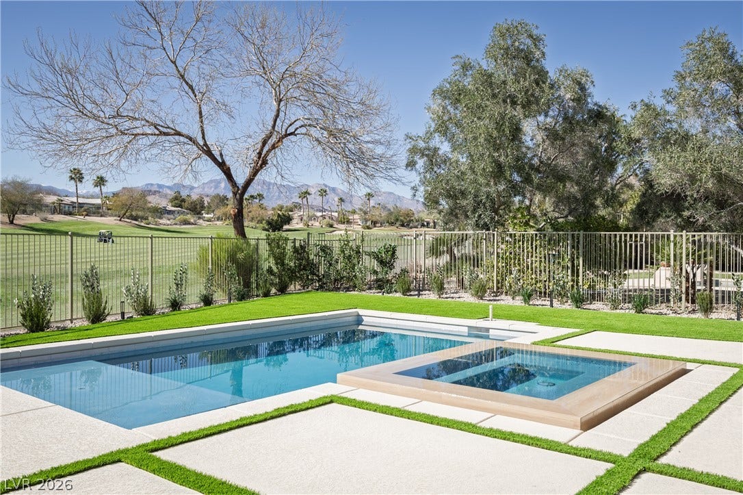 10248 Andante Court, Las Vegas, NV 89135 Combined pool / hot tub featuring a fenced backyard, a mountain view, and a patio