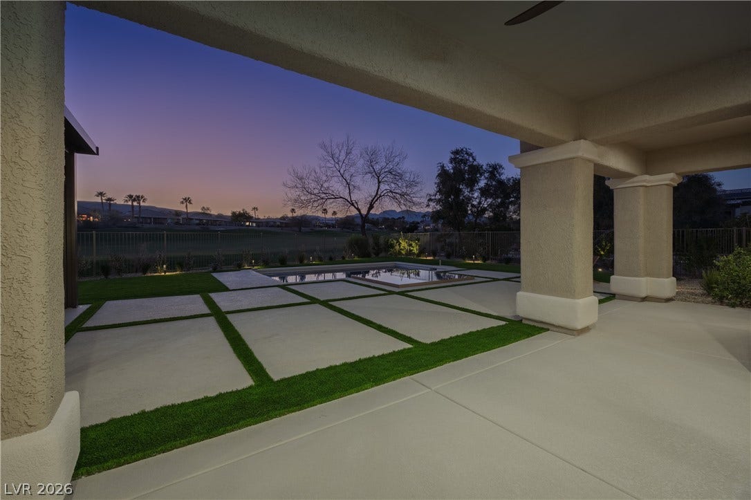 10248 Andante Court, Las Vegas, NV 89135 Patio terrace at dusk with a patio area and a fenced backyard