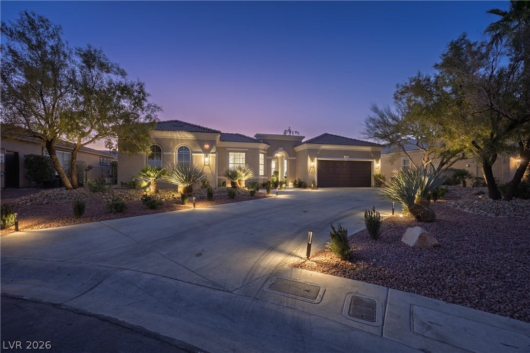 10248 Andante Court, Las Vegas, NV 89135 Mediterranean / spanish-style home featuring driveway, stucco siding, and a garage