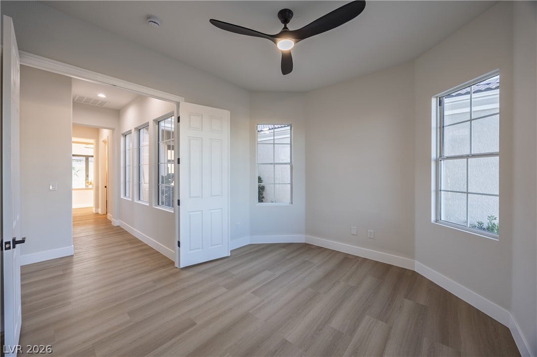 10248 Andante Court, Las Vegas, NV 89135 Spare room with a ceiling fan and light wood-style floors