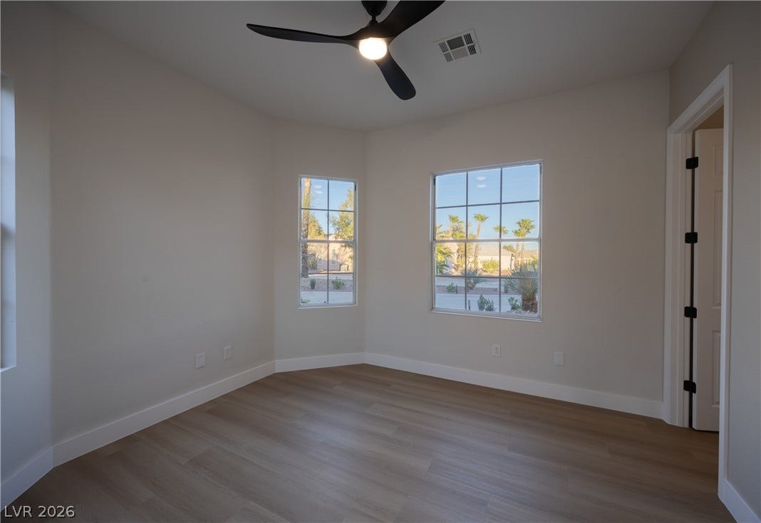 10248 Andante Court, Las Vegas, NV 89135 Unfurnished room featuring light wood-type flooring and ceiling fan