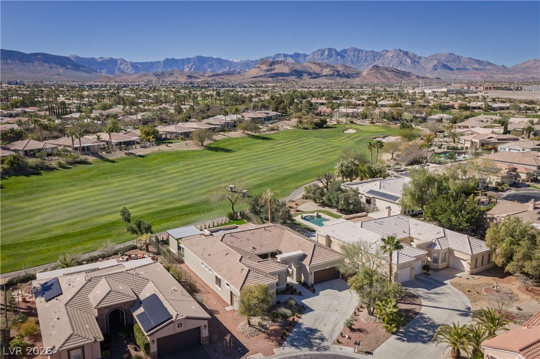 10248 Andante Court, Las Vegas, NV 89135 Aerial perspective of suburban area featuring mountains and a golf club
