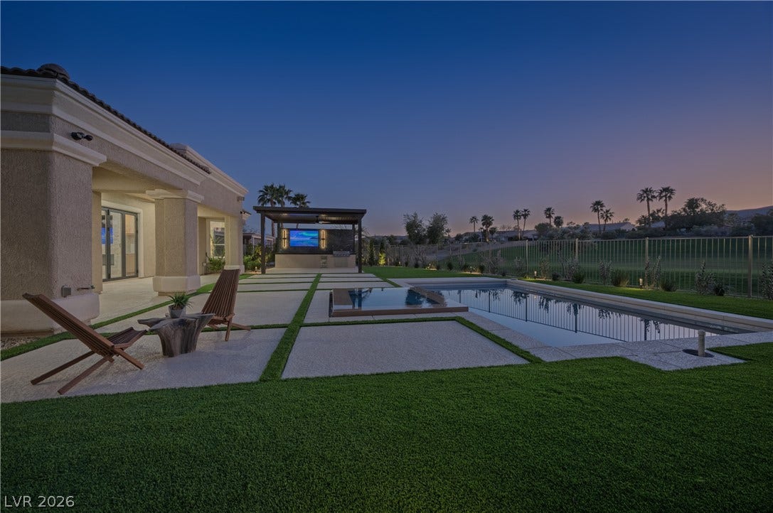 10248 Andante Court, Las Vegas, NV 89135 Pool at dusk with a patio area, a gazebo, and a pool with connected hot tub