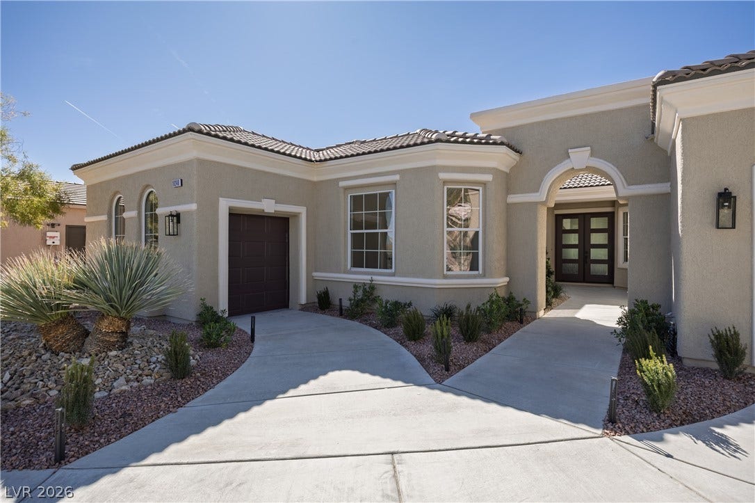 10248 Andante Court, Las Vegas, NV 89135 Mediterranean / spanish house with an attached garage, stucco siding, french doors, concrete driveway, and a tile roof
