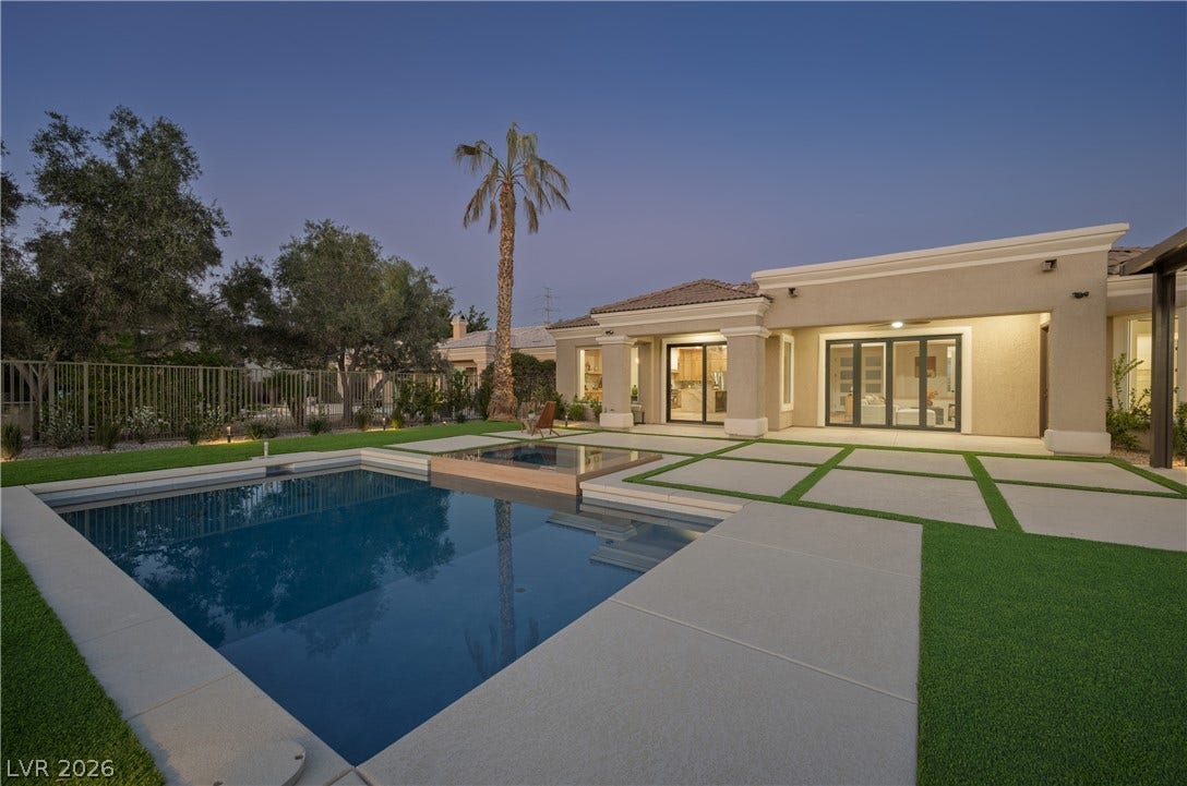 10248 Andante Court, Las Vegas, NV 89135 View of pool featuring a fenced backyard, patio surround, a jacuzzi, and french doors