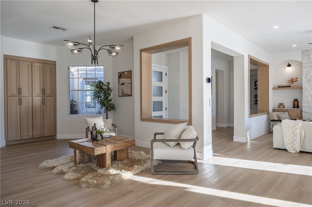 10248 Andante Court, Las Vegas, NV 89135 Sitting room featuring light wood-type flooring and suspended lighting