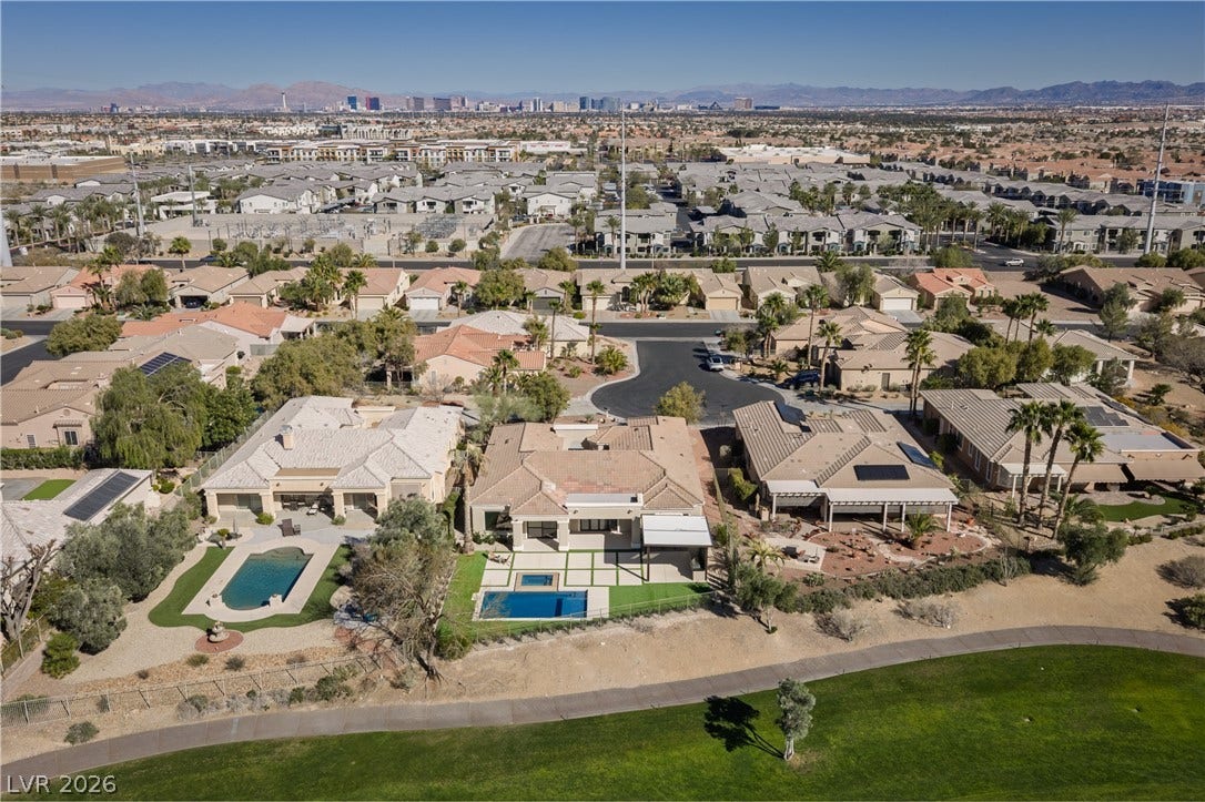 10248 Andante Court, Las Vegas, NV 89135 Drone / aerial view of mountains and a pool