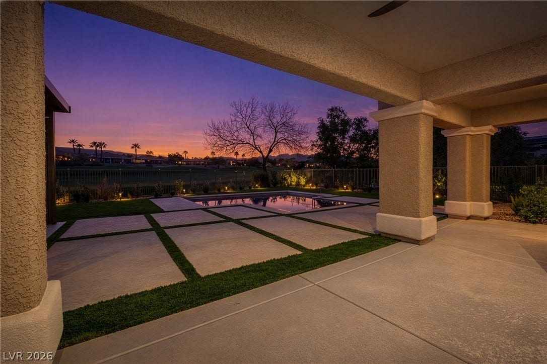10248 Andante Court, Las Vegas, NV 89135 Patio terrace at dusk featuring a fenced backyard and a patio