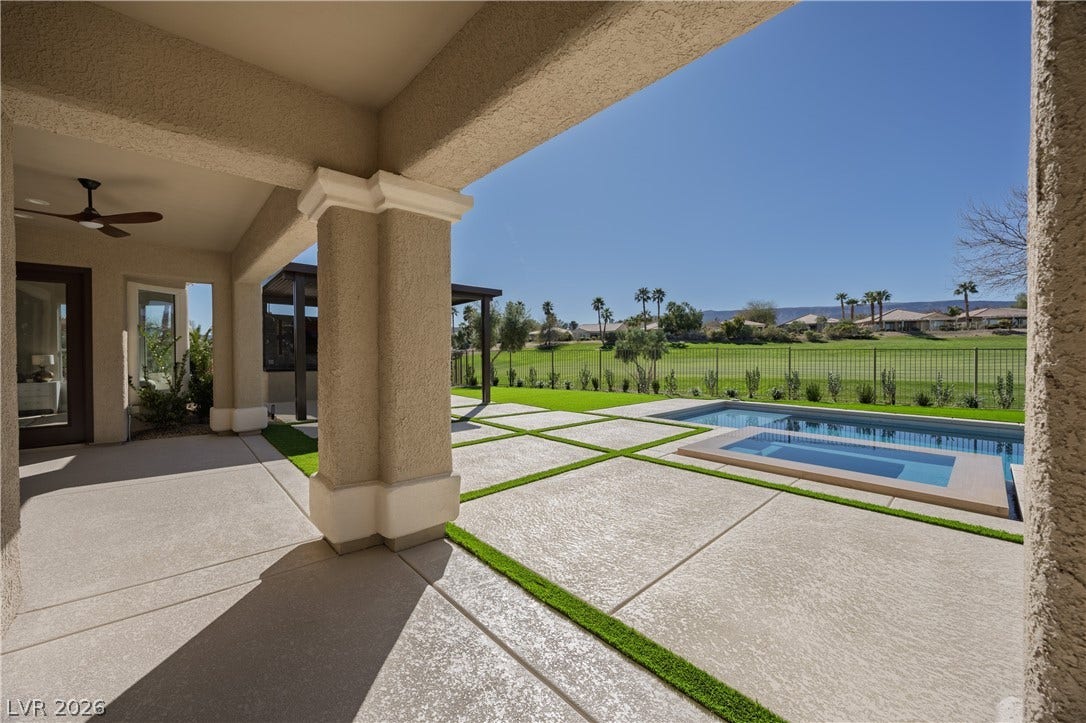 10248 Andante Court, Las Vegas, NV 89135 Relaxing pool / spa featuring a patio and a residential view