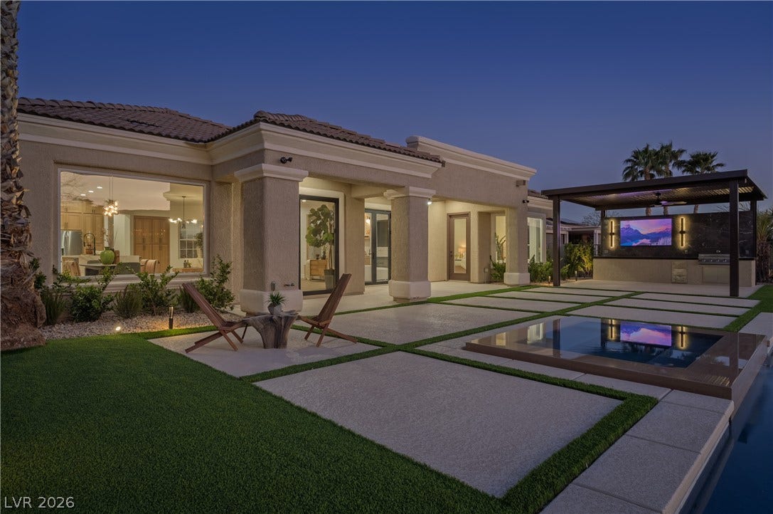 10248 Andante Court, Las Vegas, NV 89135 Rear view of house with stucco siding, an outdoor pool, a tiled roof, and a patio area