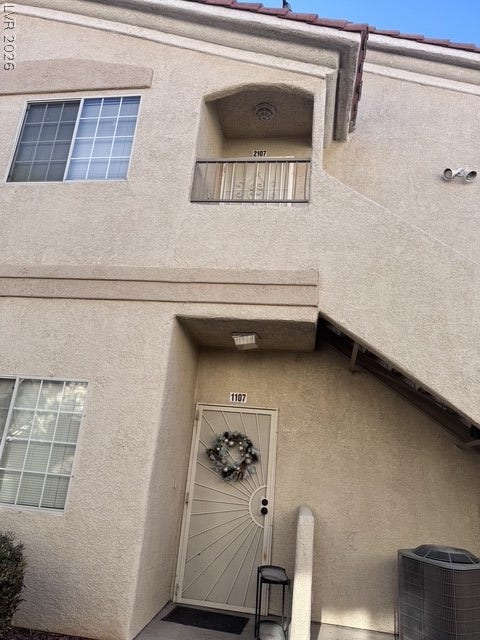 1881 W Alexander Road, #2107, North Las Vegas, NV 89032 Stucco exterior finishes and tiled roofing create a classic southwestern architectural style.