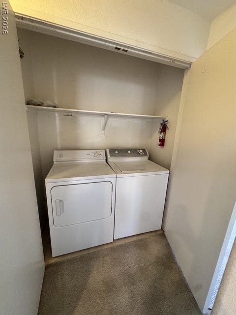 1881 W Alexander Road, #2107, North Las Vegas, NV 89032 A dedicated laundry closet provides convenient organization with built-in shelving and carpeted flooring nearby.