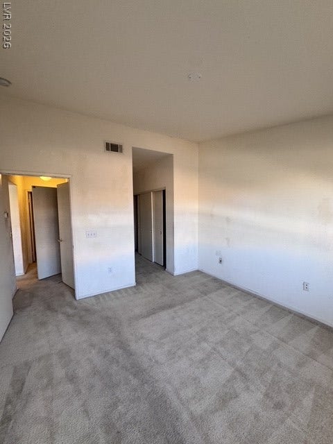 1881 W Alexander Road, #2107, North Las Vegas, NV 89032 Plush wall-to-wall carpeting and neutral walls define this versatile bedroom space.