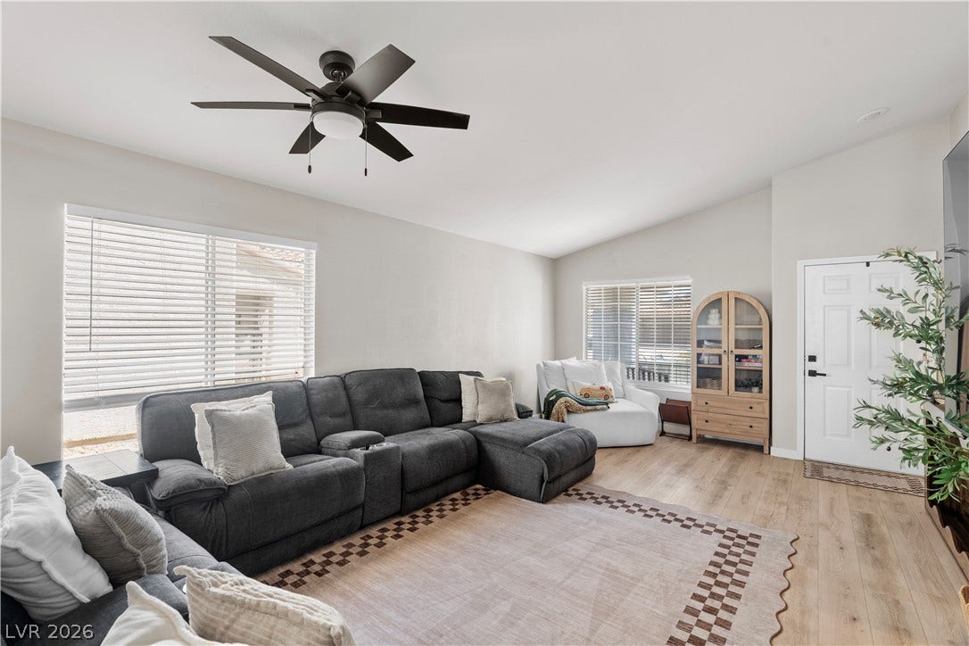 4927 Rancho Domingo Court, North Las Vegas, NV 89031 Vaulted ceilings and wide-plank wood flooring define this open living space.