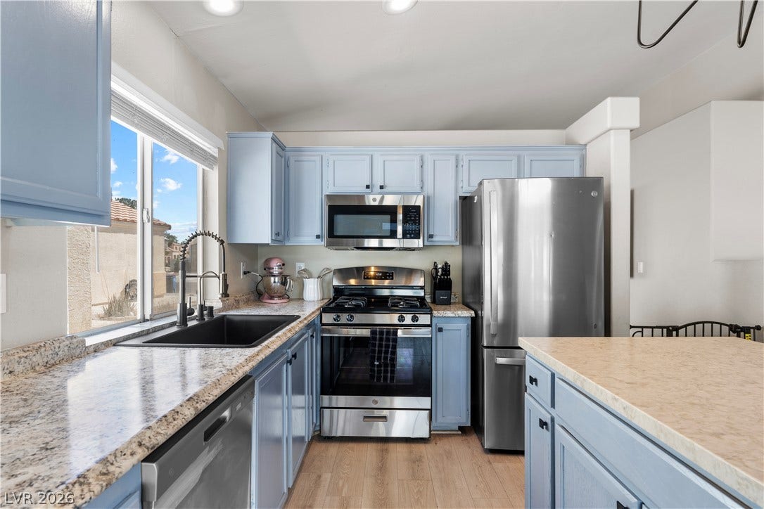 4927 Rancho Domingo Court, North Las Vegas, NV 89031 Ample counter space and classic cabinetry define this functional culinary workspace.