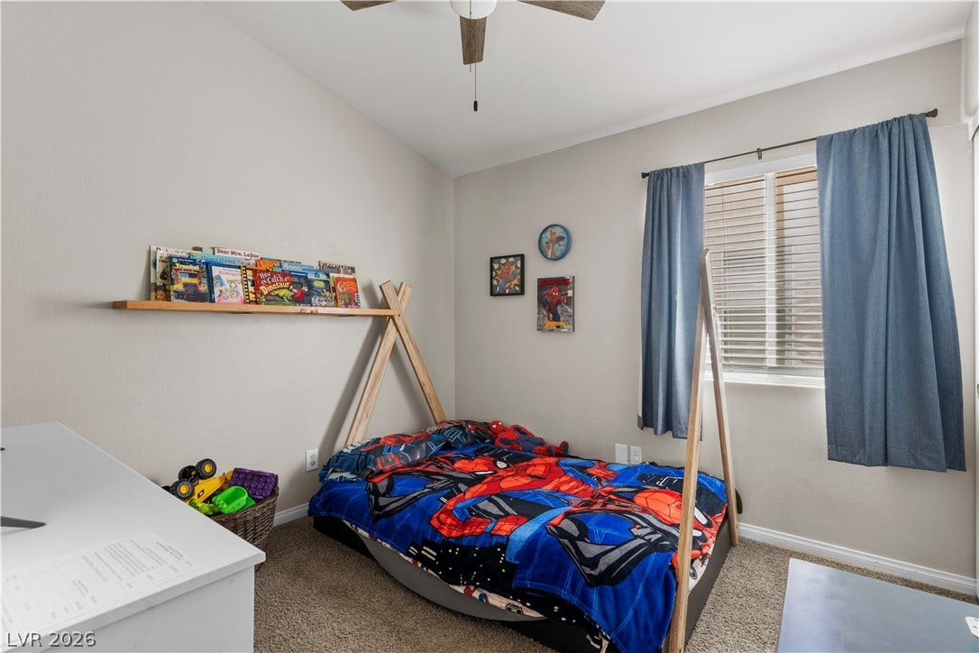 4927 Rancho Domingo Court, North Las Vegas, NV 89031 Plush carpeted flooring pairs with a classic window looking out to the neighborhood.