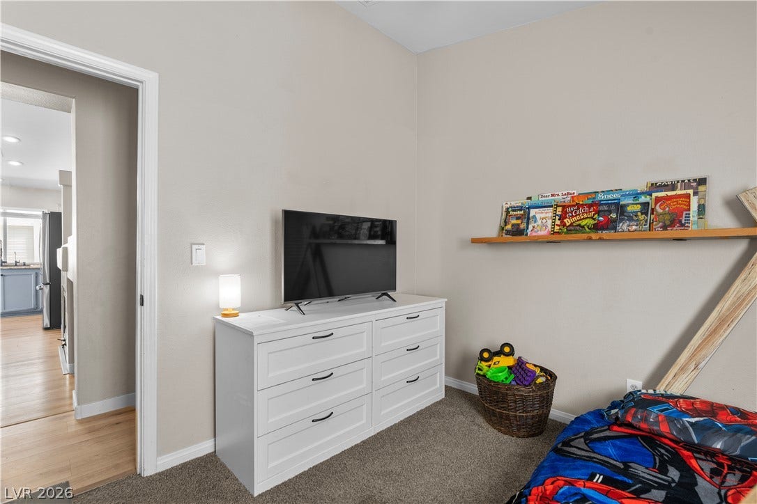 4927 Rancho Domingo Court, North Las Vegas, NV 89031 Plush carpeting and neutrally toned walls anchor this quiet secondary room.
