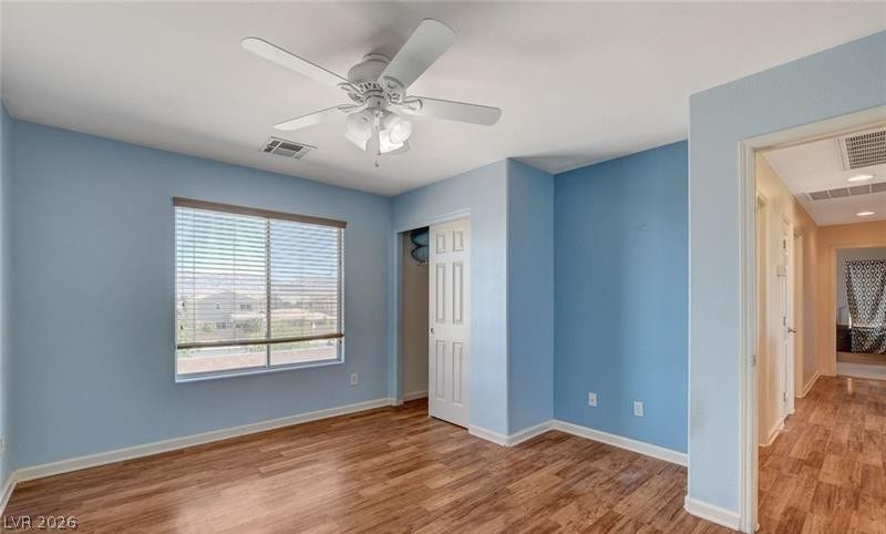 4 Goldleaf Falls Avenue, North Las Vegas, NV 89031 Rich wood flooring pairs elegantly with light walls under high ceilings in this tranquil space.