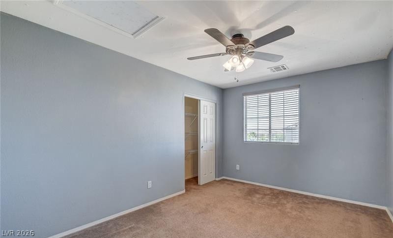 4 Goldleaf Falls Avenue, North Las Vegas, NV 89031 A windowed secondary bedroom features wall-to-wall carpeting and an adjoining closet.