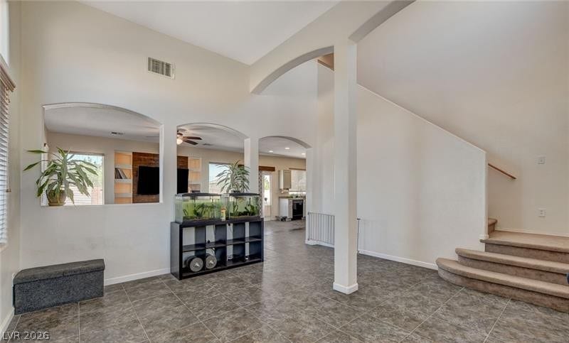 4 Goldleaf Falls Avenue, North Las Vegas, NV 89031 Tiled flooring and soaring vaulted ceilings define this welcoming open entryway.