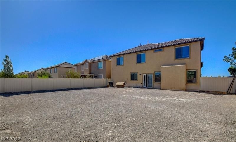 4 Goldleaf Falls Avenue, North Las Vegas, NV 89031 An expansive fenced backyard offers endless possibilities for custom landscaping and outdoor activities.