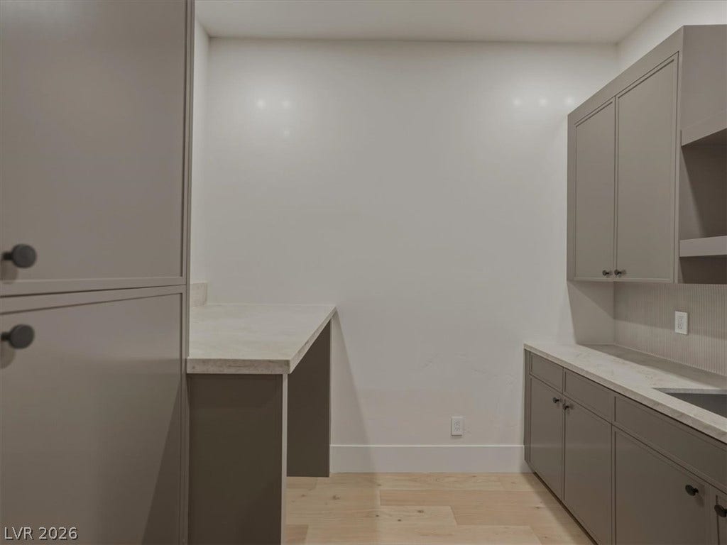 3 Isleworth Drive, Henderson, NV 89052 A well-appointed utility space features ample cabinet storage and convenient countertop areas.