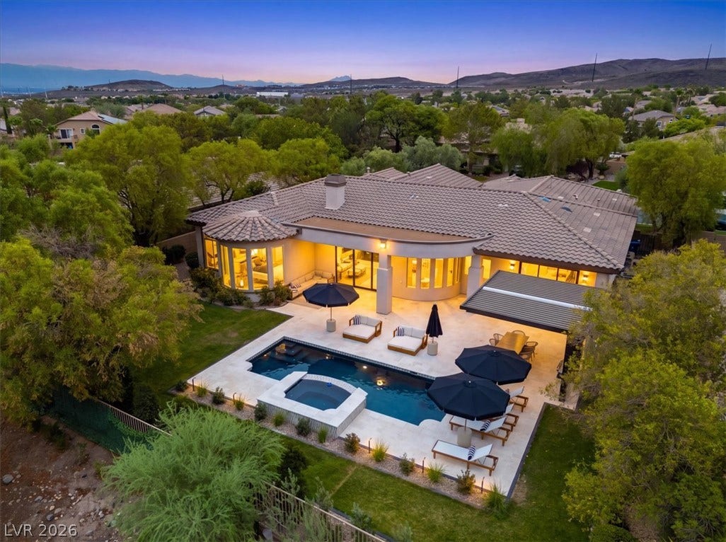 3 Isleworth Drive, Henderson, NV 89052 A private backyard oasis features an inviting pool and spa, perfect for tranquil evenings.
