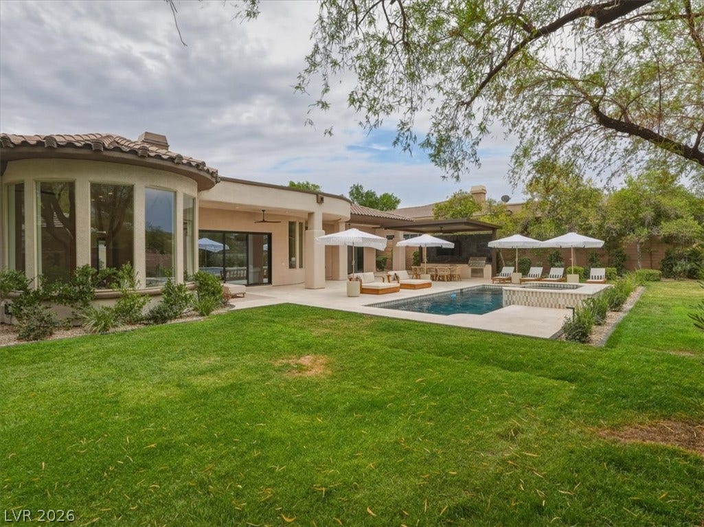 3 Isleworth Drive, Henderson, NV 89052 An inviting private pool and patio area await, perfect for outdoor entertaining and tranquil relaxation.