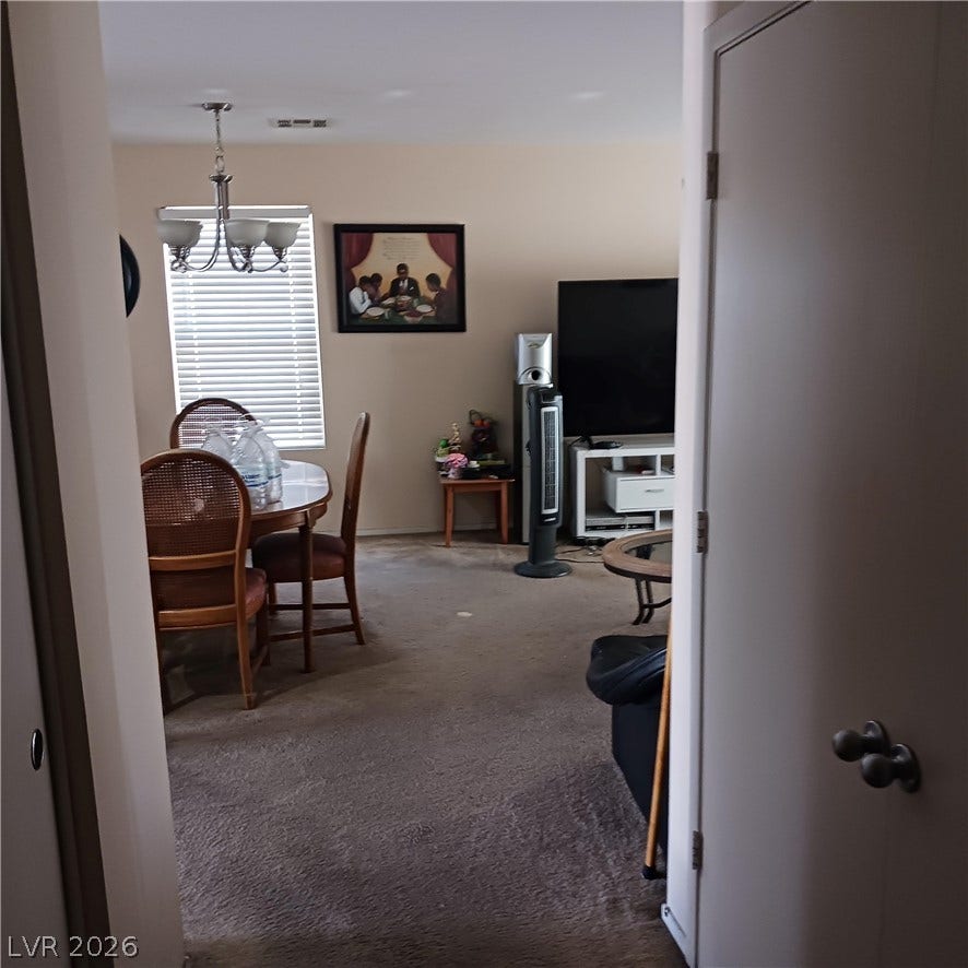 1705 Ronzard Avenue, North Las Vegas, NV 89032 An open living and dining area awaits just past the entry hallway.