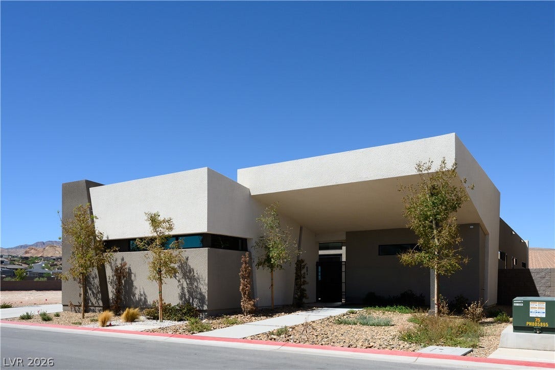 Striking contemporary architecture defines this modern residence with a bold geometric facade.