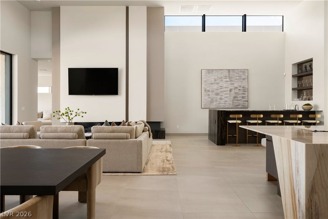 High ceilings and clerestory windows elevate this vast, open-concept living area.