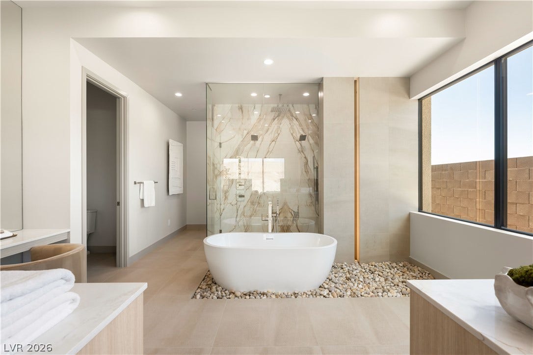 Clean lines and a freestanding tub define this contemporary primary bathroom retreat.
