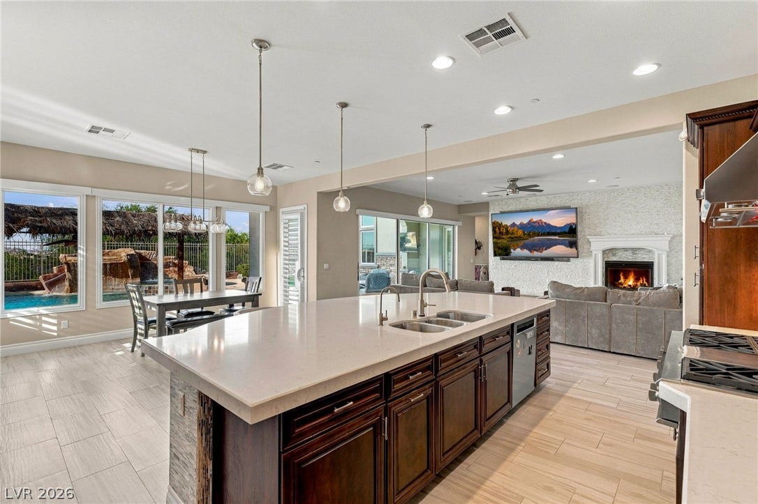 1372 Enchanted River Drive, Henderson, NV 89012 An open kitchen design connects seamlessly to adjacent dining and living spaces.