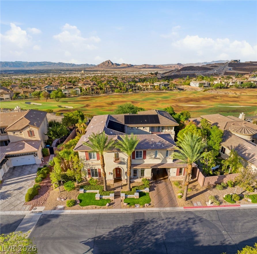 1372 Enchanted River Drive, Henderson, NV 89012 Majestic mountain and golf course views frame this classic multi-level residence with solar panels.