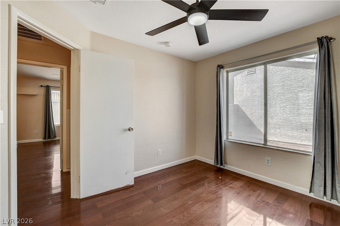 5239 Ferrell Mountain Court, North Las Vegas, NV 89031 Gleaming hardwood floors and a large window define this comfortable space.