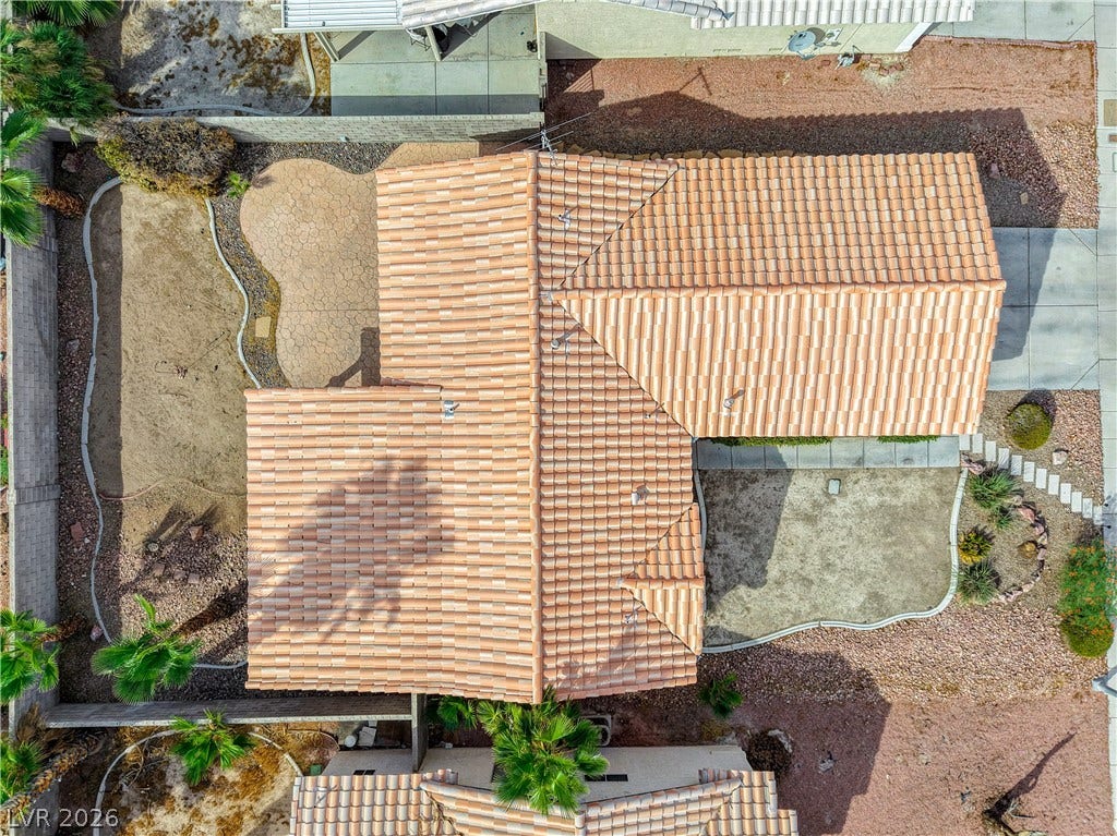 5239 Ferrell Mountain Court, North Las Vegas, NV 89031 An aerial perspective showcases the classic Spanish tile roof and the surrounding yard design.