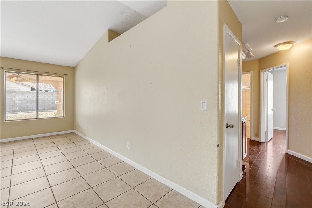 5239 Ferrell Mountain Court, North Las Vegas, NV 89031 Gleaming tile floors and vaulted ceilings define this versatile open interior layout.