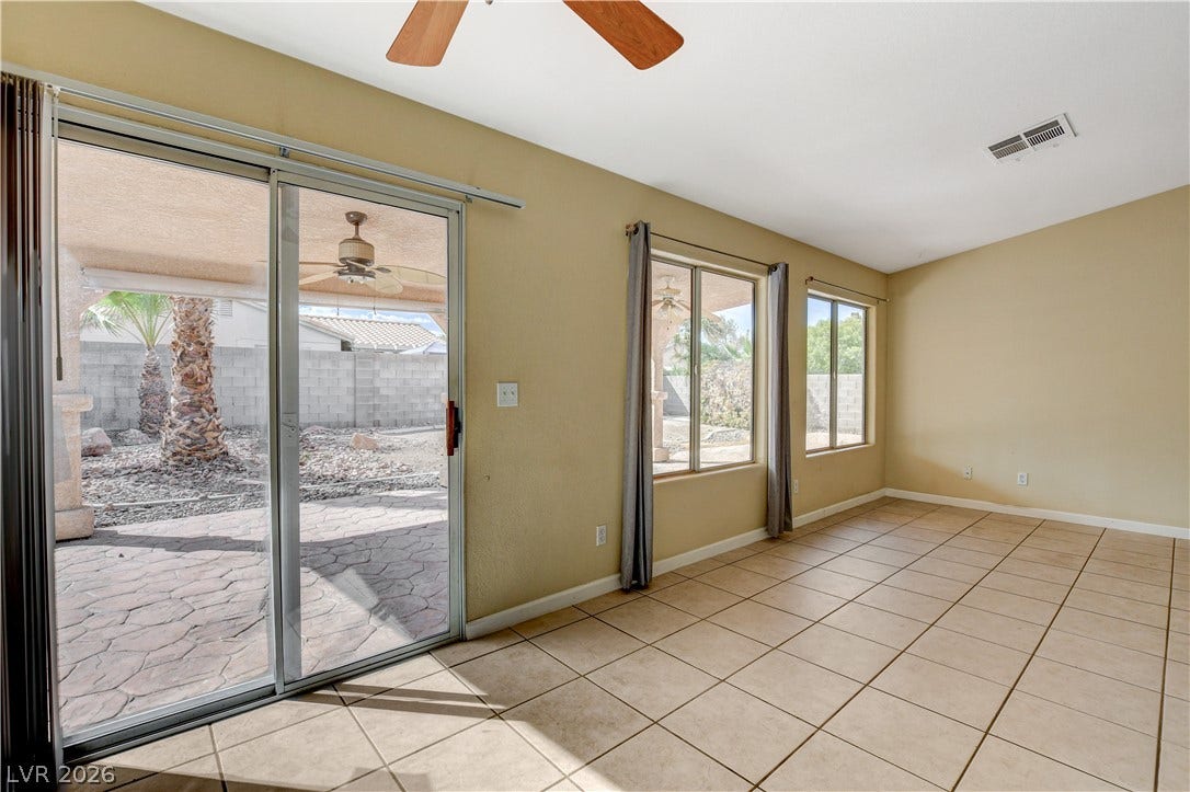 5239 Ferrell Mountain Court, North Las Vegas, NV 89031 Tiled flooring and large glass doors create a seamless transition to the outdoor patio.