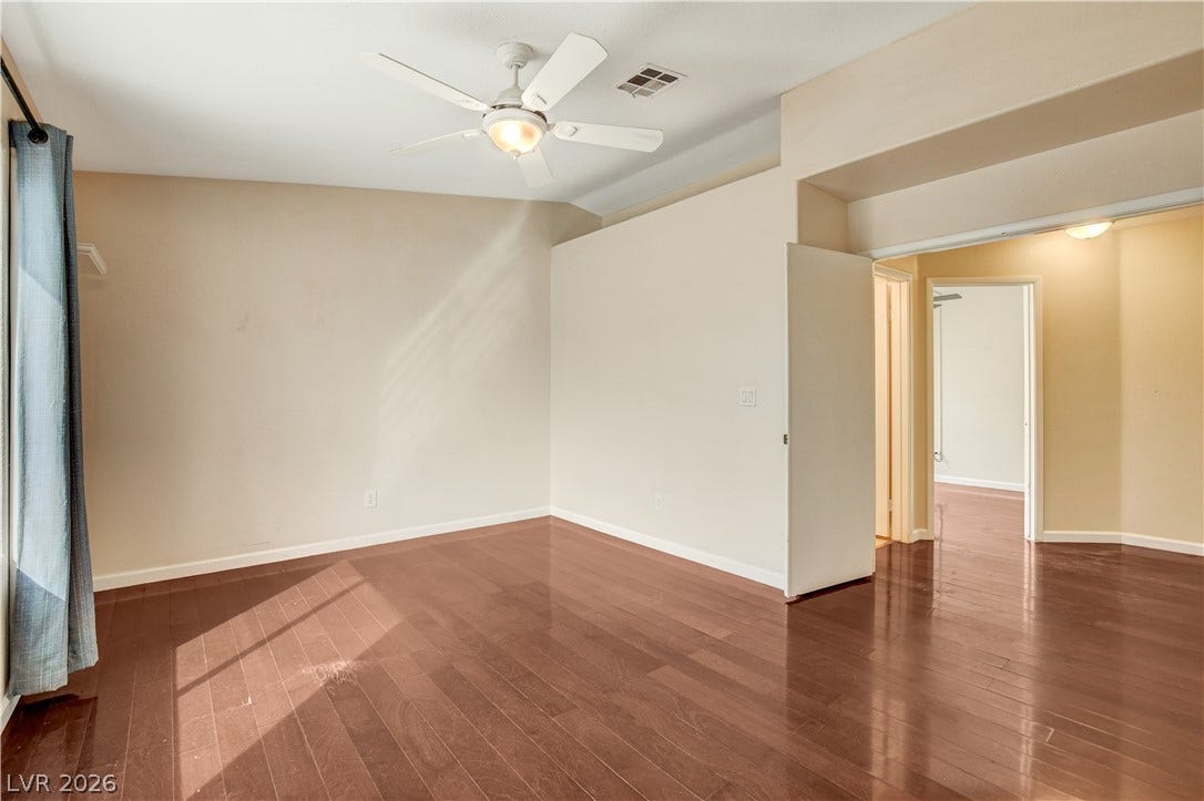 5239 Ferrell Mountain Court, North Las Vegas, NV 89031 Gleaming hardwood floors and vaulted ceilings elevate this open interior space.