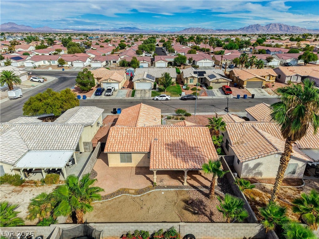 5239 Ferrell Mountain Court, North Las Vegas, NV 89031 Distant mountain ranges form a dramatic backdrop for this tile-roofed desert home and its neighborhood.