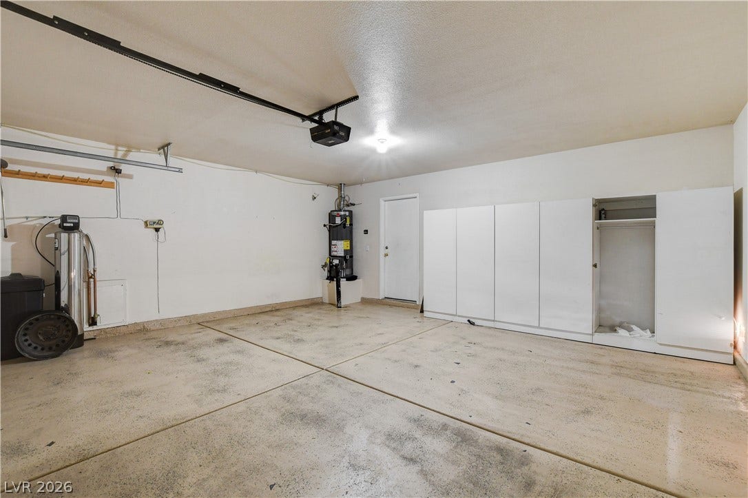 5239 Ferrell Mountain Court, North Las Vegas, NV 89031 Ample built-in storage cabinets line the wall of this functional and spacious garage space.