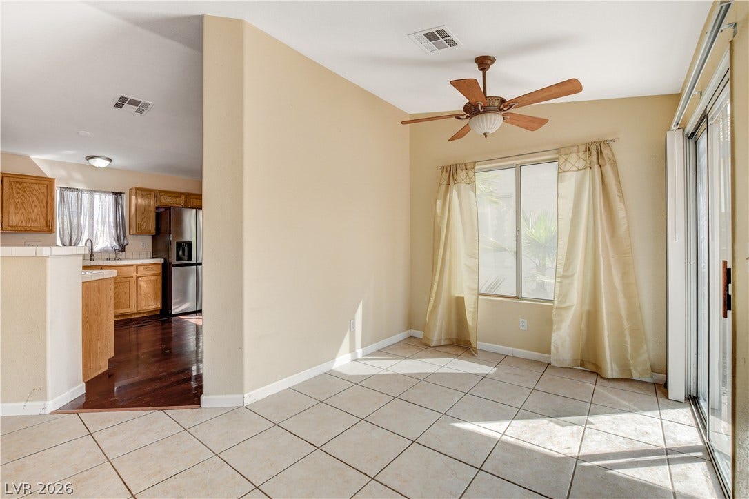 5239 Ferrell Mountain Court, North Las Vegas, NV 89031 Tiled flooring and sliding glass doors create a seamless flow to the adjacent kitchen.