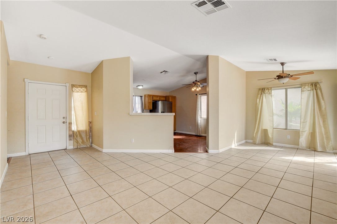5239 Ferrell Mountain Court, North Las Vegas, NV 89031 Tiled flooring and large windows enhance this welcoming main living area.