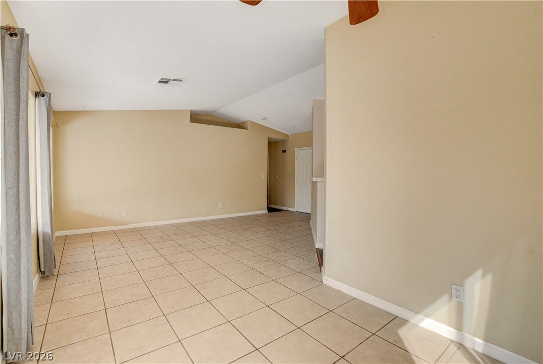 5239 Ferrell Mountain Court, North Las Vegas, NV 89031 Tiled flooring and neutral walls define this versatile, open living area.