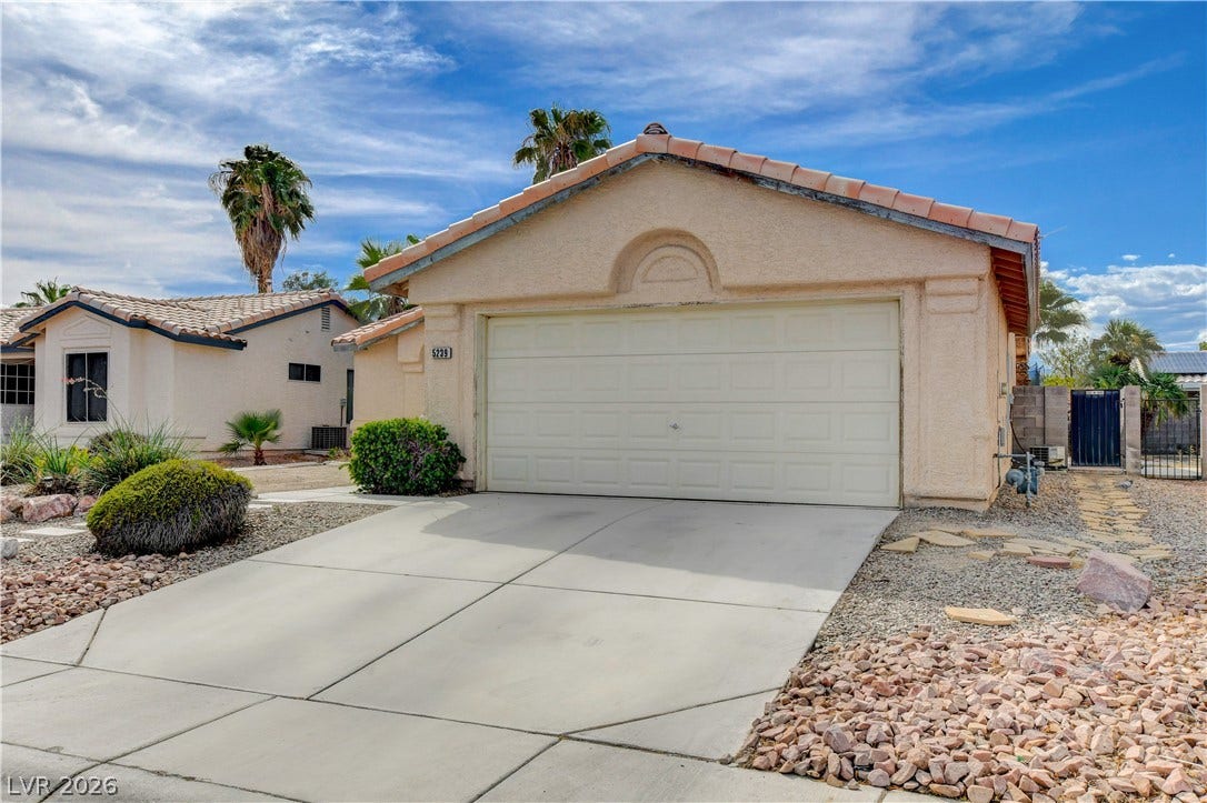 5239 Ferrell Mountain Court, North Las Vegas, NV 89031 An inviting stucco exterior features a concrete driveway leading to the attached garage.