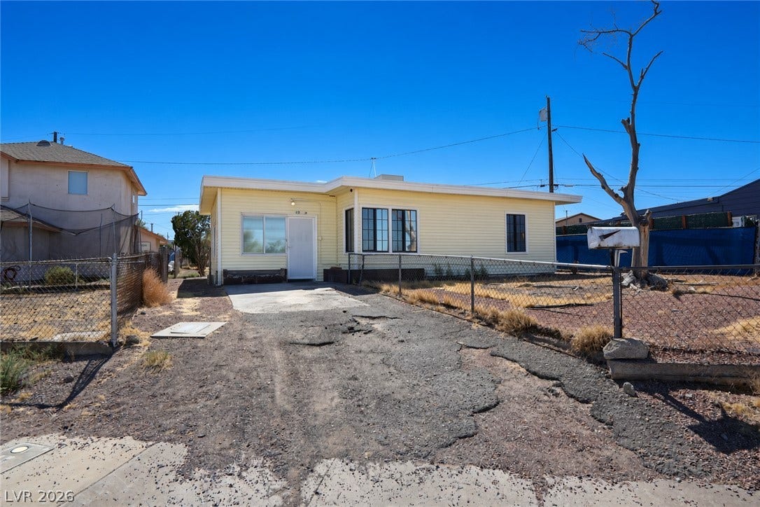 123 W Victory Road, Henderson, NV 89015 Simple single-level living defines this classic residence set behind a fenced front yard.
